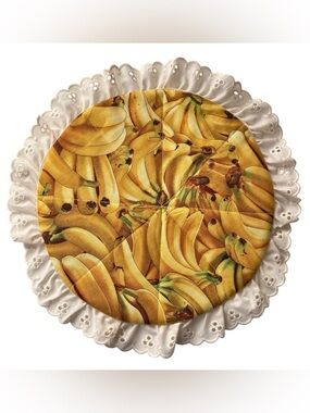 Vintage handmade round banana print trivet with lace trim
